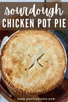 a chicken pot pie sitting on top of a wooden table