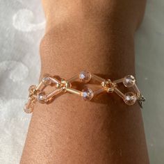 From a small business in Switzerland💖Welcome to my shop💖This uniquely designed bracelet, will add an elegant touch to your daily outfits. Handmade out of (rosé) glass beads as well as a stainless steel lobster clasp and jump rings. You can add a smiley charm if you want to.  💖Features: Made out of very high quality materials. Doesn't tarnish easily/doesn't turn skin "green". Elastic and stretchy; adjustable. Very resilient to various environments, inc. water, humidity, etc. Materials come fro Adjustable Gold Glass Bracelet, Rose Bracelet, Unique Roses, Glass Bracelet, Wedding Jewelry Bracelets, Wedding Bracelet, Jump Rings, Daily Outfits, Smiley