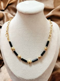 This Black Onyx necklace/Black and gold necklace/Gold rose and black onyx necklace/Black gemstone/Black chain necklace looks so unique. It is made with 4X13mm black Onyx round tube beads. The rose beads and all other metal parts, including the chain, and the lobster claw clasp, are all 18k gold (vacuum-plated on stainless steel), which is tarnish-resistant and skin-friendly. If you want to learn more about vacuum plating technique and stainless steel (vs. sterling silver), please read the third Black And Gold Necklace, Black Stone Necklace, Black Chain Necklace, Rose Beads, Black Beads Mangalsutra, Black Beads Mangalsutra Design, Fancy Jewelry Necklace, Black Gold Chain, Gold Mangalsutra Designs