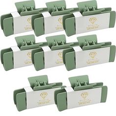 six green and white business card holders with diamond logo on each side, set of 10