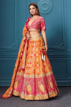 Dance like a diva on sangeet, mehendi, and wedding in this gorgeous orange bandhej print silk lehenga with gotta patti work and beautifully decorated borders. Featuring with a beautiful V neck and 3/4th sleeve blouse. Shop online at Pure Elegance or visit our store in the USA. Multicolor Bandhani Print Lehenga For Reception, Traditional Bandhani Print Dupatta For Reception, Bandhani Print Sharara For Reception And Festivals, Festival Sharara With Bandhani Print For Reception, Bollywood Traditional Wear With Bandhani Print For Reception, Reception Lehenga With Bandhani Print, Bandhani Print Lehenga For Reception And Navratri, Navratri Lehenga With Bandhani Print For Reception, Navratri Reception Lehenga With Bandhani Print