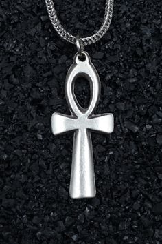 The ancient silver-plated necklace stands out with the Ankh symbol, transcending through ages. This symbol represents eternal life, resurrection, and spiritual balance. Crafted for both men and women, this special necklace captivates with intricately detailed craftsmanship and profound meaning. Made with high-quality materials, this unique piece of jewelry offers various chain types and lengths, catering to diverse preferences. Each chain elegantly brings the Ankh symbol to the wearer's chest, blending elegance and style. The necklace's durability and aesthetics evoke a sense of freedom and immortality. The antique silver-plated necklace dazzles with the profound meaning of the Ankh symbol. Specifically designed for men and women, this unique piece of jewelry carries the mystical ambiance Silver Symbolic Cross Necklace, Spiritual Cross Jewelry In Metal, Spiritual Metal Pendant Cross Necklace, Symbolic Metal Cross Necklace, Spiritual Metal Cross Pendant Necklace, Spiritual Metal Cross Necklaces, Spiritual Stainless Steel Cross Pendant Necklaces, Symbolic Engraved Cross Necklaces, Silver Spiritual Charm Necklaces In Stainless Steel