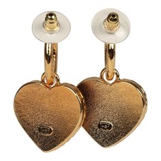 These Chanel CC denim heart earrings feature small gold tone metal CC hoops with a dangling gold and blue Denim enamel heart, with a gold tone CC in the center, and have post back earring closure. Origin: ItalyCondition: New and never wornAccompanied by: Box, felt jewelry cover, ribbon, carebook and retail UPC, Measurements: 1.5" (top of hoop to bottom of heart) x 1" (across heart) Gold Metal Earrings With Heart Charm, Pierced Yellow Gold Heart Metal Earrings, Gold Enamel Heart Charm Earrings, Gold Enamel Heart Earrings For Valentine's Day, Gold Enamel Heart Earrings, Yellow Gold Heart Charm Earrings, Gold Heart-shaped Earrings With Dangling Charms, Heart-shaped Gold Earrings With Dangling Charms, Yellow Gold Heart Earrings With Charm