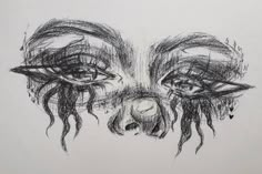 a drawing of two eyes with tears on them