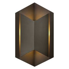 a wall light that is shaped like a hexagonal object