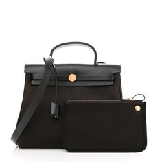 SCUThis is an authentic HERMES Toile Vache Hunter Herbag Zip Retourne 31 PM in Black and Ebene. This stylish tote is crafted of sturdy toile canvas in dark brown.The shoulder bag features a rear exterior zip pocket, a brown leathertop crest with a leather top handle, a shoulder strap, and strap closure with polished gold hardware including a padlock. The flap opens to a canvas interior with a removable pouch. Hermes Products, Brown Leather Top, Marble Print, Hermes Bags, Leather Top, Gold Hardware, Top Handle, Dark Brown, Zip Pockets