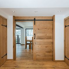 an open wooden door in a white room