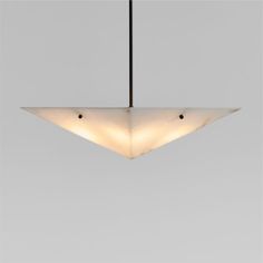 a modern light fixture hanging from the ceiling