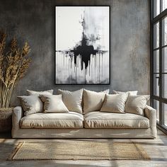 a living room filled with furniture and a large painting hanging on the wall above it