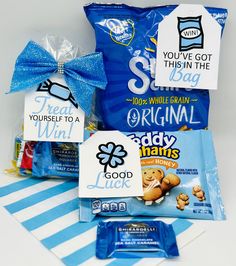 some kind of snack bag with blue ribbon around it