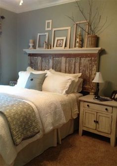 a bedroom with a bed, nightstand and pictures on the wall above it's headboard