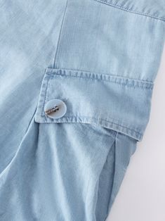 This Button Cargo Pocket Skirt-Denim is expertly designed to provide both style and functionality. The perfect addition to any wardrobe. Casual Summer Skirt With Button Cuffs, Denim Blue Button-up Bottoms For Summer, Summer Button-up Denim Blue Bottoms, Washed Blue Denim Bottoms With Buttons, Straight Leg Bottoms With Buttoned Pockets For Summer, Summer Straight Leg Bottoms With Buttoned Pockets, Summer Straight Leg Skirt With Button Closure, Spring Washed Blue Bottoms With Button Closure, Button-up Denim Blue Cotton Bottoms