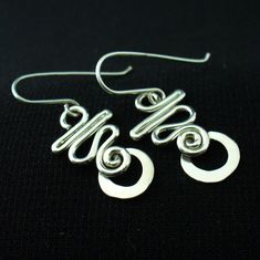 These earrings are hand crafted in solid sterling silver.I use 16 gauge wire for these so they're nice and light but not flimsy.For a unique,long lasting and clearly handmade pair of everyday dangles that won't break the bank.These will do the trick. Hypoallergenic Silver Wrap Earrings In Sterling Silver, Hypoallergenic Silver Sterling Silver Wrap Earrings, Hypoallergenic Sterling Silver Wrap Earrings, Handmade Spiral Sterling Silver Wrap Earrings, Silver Spiral Wrap Earrings In Sterling Silver, Modern Adjustable Sterling Silver Wrap Earrings, Adjustable Hypoallergenic Sterling Silver Wrap Earrings, Minimalist Silver-plated Wire Jewelry, Handmade Sterling Silver Dangle Wrap Earrings