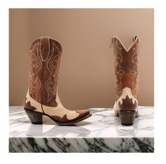 Idyllwind Women's Speedway (Snip Toe) Western Boots Medium Sizes, featuring a classic brown color scheme and a chic tan vamp with a brown shaft and intricate overlay design that adds a touch of sophistication to your outfit. Made from high-quality leather, these boots offer a timeless and stylish look that's perfect for any occasion. The snip toe and pull-on style with pull tabs make these boots easy to slip on and off, while the 12" shaft height provides coverage and support. The Western heel a Casual Brown Boots For Ranch, Brown Boots With Reinforced Heel For Western-themed Events, Brown Almond Toe Boots For Rodeo, Brown Closed Toe Boots For Ranch, Closed Toe Brown Boots For Ranch, Brown Pointed Toe Country Boots, Country Style Brown Boots With Reinforced Heel, Brown Medium Width Boots For Rodeo, Medium Width Brown Boots For Rodeo