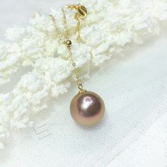 Genuine Kasumi pearl in rich and intriguing exotic color with strong metallic overtone, sized 12.5 mm, perfect round shape set in simple well-made 18KT solid yellow gold lariat chain. The surface of pearl is very clean, there is only one slightly growing mark on the back side, can not be shown by pictures. All pearls in shop are picked by hand to assure the high quality of luster and surface, it is a perfect gift for Anniversary, Birthday, Engagement, Wedding, Mother's day, Valentine's day or ju Gold Tahitian Pearl Necklace, Elegant Gold Tahitian Pearl Necklaces, Elegant Gold Tahitian Pearl Necklace, Gold Necklace With Tahitian Pearl Round Beads, Elegant Gold Tahitian Pearl Jewelry, Pearl Necklace With Adjustable Chain, Round Pearl Necklace With Adjustable Chain, Formal Gold Necklace With Tahitian Pearl, Formal Gold Tahitian Pearl Necklace