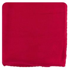 a red blanket folded on top of a white surface