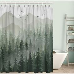 a bathroom with a shower curtain that has trees on it and birds flying in the sky