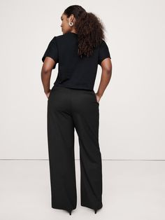 Meet the high-rise pants we can't stop wearing.  We cut these wide-leg pants with a double-pleated front for a borrowed-from-the-boys vibe.  For fabric, the design team selected our signature Sienna Italian wool to strike the perfect balance between tailored and feminine.  Wide-Leg: Ultra high-rise (12") with a relaxed, wide leg.  Full length.  Fabric sourced from Italy's Marzotto Mill.  Zip fly with button closure.  Belt loops.  Front and back pockets.  Unlined.  *This style runs small.  Consid Versatile Wide-leg Dress Pants With Relaxed Fit, Wide Leg Sweatpants With Elastic Waistband For Work, Versatile Wide-leg Sweatpants For Work, Versatile Wide Leg Sweatpants For Work, Black Wide Leg Pants With Welt Pockets, Wide Leg Black Pants With Welt Pockets, Relaxed Fit Wide Leg Pants With Welt Pockets, Wide Leg Pants With Welt Pockets And Relaxed Fit, Relaxed Fit Wide Leg Dress Pants With Welt Pockets