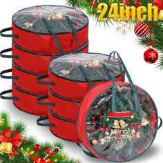 four red christmas buckets filled with candy