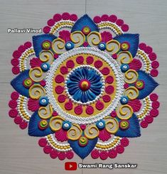 this is an image of a colorful flower design on the wall or floor in india