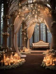 an outdoor wedding venue with candles and flowers on the aisle, surrounded by white roses