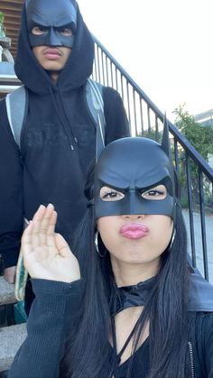 two people dressed up as batman and catwoman