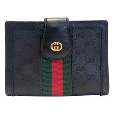 Gucci black web card holder featuring black monogram cloth and black leather, GG gold tone metal frontal logo, inside Gucci metal plaque, 2 internal compartment and plastic folder for cards, Made in Italy Dimensions: 9x7x2cm Condition: 1980s, vintage, excellent, like new Modern Black Wallet With Logo Plaque, Black Rectangular Card Holder With Logo Plaque, Black Wallets With Logo Plaque For Everyday Use, Black Leather Card Holder With Logo, Black Business Wallet With Logo Plaque, Classic Black Card Holder With Logo Plaque, Luxury Black Wallet With Logo, Classic Black Card Holder With Logo, Black Leather Card Holder With Logo Plaque