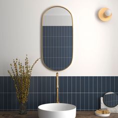 a bathroom with a sink, mirror and vase filled with flowers on the counter top