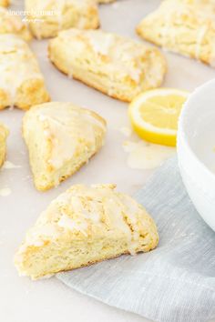 lemon scones with icing next to a white bowl