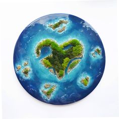 a heart shaped island on top of a blue plate