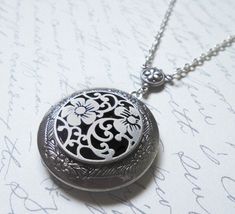 The antique silver plated floral engraved locket is 32mm. An antique silver Renaissance style pattern adorns the front of this locket. The locket is connected to a 24 inch chain by a rosary style connector. The locket is packaged in a lovely little silhouette box, set on a soft piece of white cotton. ♥ * ♥ * ♥ * ♥ * ♥ * ♥ * ♥ * ♥ © Original design by Twilight's Castle Thank you for visiting! Twilight's Castle Vintage Antique Silver Locket Necklace Nickel Free, Antique Silver Round Locket Necklace Nickel Free, Vintage Nickel Free Antique Silver Locket Necklace, Silver Locket Necklace With Vintage Charm, Silver Locket Necklace With Intricate Design For Gift, Antique Silver Pendant Locket Necklace Gift, Antique Silver Pendant Locket Necklace For Gift, Antique Silver Pendant Locket Necklace As A Gift, Nickel Free Silver Medallion Locket Necklace