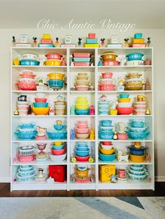 the shelves are filled with colorful dishes and bowls