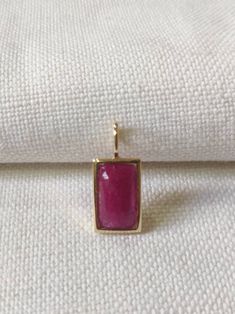 This stunning Pendant is set in 14k Solid Yellow Gold with Natural Ruby with utmost precision. It is a unique gemstone Pendant for nearly every occasion and is completely hassle-free jewelry. ITEM DETAILS: *  GEM: Ruby * GEM SIZE: 7X13mm * GEM SHAPE: Octagon * Gem weight: 3.88 carats * Gold Purity: 14KT (58.33% approx.) * Gold Weight: 1.5 gram * Total Weight of the Pendant: 2.27 gram The Gold purity is guaranteed and it comes with authentic 14KT gold hallmark. Since my items are handmade, they a Fine Jewelry With Rectangular Gemstone Accents, Fine Jewelry With Gemstone Accents Rectangular Shape, Elegant Jewelry With Bezel Setting Rectangular Pendant, Luxury Rectangular Gemstone Pendant Jewelry, Luxury Jewelry With Rectangular Gemstone Accents, Elegant Jewelry With Rectangular Pendant And Natural Stones, Fine Jewelry With Rectangular Birthstone, Yellow Gold Faceted Jewelry With Rectangular Stone, 14k Gold Jewelry With Bezel Set Rectangular Stone