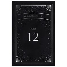 a black and white wedding table card with the number twelve on it's front