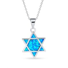 Vibrant and fun, this blue lab-created opal Star of David pendant is a casual display of your faith you can wear with everything. Fashioned in sterling silver This Star of David design glistens with iridescent blue lab-created opal cabochon inlays - a hexagon-shaped center surrounded by triangle shapes along the sides. This pendant suspends along an 18.0-inch rolo chain that secures with a spring-ring clasp. Silver Star Of David Birthstone Jewelry, Silver Star Of David Jewelry With Birthstone, Blue Gemstone Star Of David Jewelry, Blue Star Of David Gemstone Jewelry, Blue Sterling Silver Star Of David Necklace, Sterling Silver Jewelry For Hanukkah Gifts, Blue Star Of David Jewelry Gift, Star Of David Pendant, Synthetic Opal