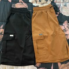 Two Pair Of Never Worn Men’s Cargo Shorts. Black And Copper Both Are Size Medium Casual Brown Shorts With Side Pockets, Brown Streetwear Shorts With Pockets, Brown Pocketed Shorts For Streetwear, Brown Shorts With Pockets For Streetwear, Casual Brown Cargo Shorts, Brown Cargo Shorts With Cargo Pockets, Black Cargo Style Shorts, Brown Cotton Shorts For Streetwear, Brown Streetwear Shorts