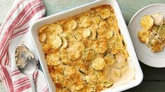 a casserole dish with zucchini and mushrooms in it on a table