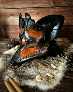 Description Customization Shipping Product Description This custom, handmade and hand-molded leather fox mask is sure to awaken the fae magic within you. Featuring thick leather and a durable, adjustable leather strap, this costume piece is perfect for LARP, SCA, Halloween, Renaissance Faires, festivals, or even pagan rituals. Mythic Beasts This Collection of handmade leather masks & headdresses is inspired by the creatures and animals of ancient mythology. Each unique design is completely m Fae Magic, Fox Costume, Runic Alphabet, The Fae, Pagan Rituals, Fox Mask, Elder Futhark, Ancient Mythology, Leather Mask