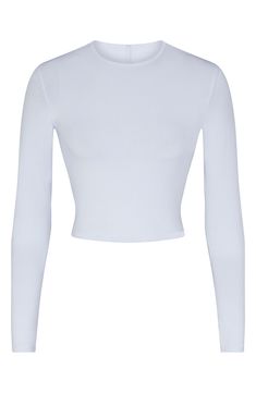 Specially washed for a vintage appearance, this long-sleeve top from Kim Kardashian's SKIMS is cropped to hit you at your natural waist. 17" regular length (size Medium) Crewneck Long sleeves 92% cotton, 8% spandex Machine wash, dry flat Imported Best Friends Brother, Aesthetic Gift, Cropped Long Sleeve, Tan Lines, Free Fabric, Long Sleeve Crop Top, New Vintage, Kim Kardashian, Gift Guide