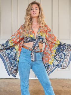 SILK BELL SLEEVE CROP TOP - RAINBOW FIRE SKY ** LIMITED PRINT AVAILABLE **  Handmade recycled silk crop kimono with amazing billowing bell sleeves and gold printed fabric! The gold shimmers and shines, the photos don't do it justice!  This incredible silk crop top is the perfect addition to any outfit, with flowing sleeves and bohemian vibe, this is an amazing bespoke piece to add to any wardrobe!  Our 'Bella' tops were dreamed up in the sunshine and are a twist on our classic 'Stevie' tops and Spring Vacation Top With Vintage Print, Spring Vacation Tops With Vintage Print, Hippie Long Sleeve Crop Top For Spring, Multicolor Batwing Sleeve Tops For Spring, Vintage V-neck Top With Boho Print, Spring Vacation Vintage Print Tops, Multicolor Boho Print Rayon Top, Bohemian Rayon Top With Boho Print, Bohemian Flowy Crop Top For Spring