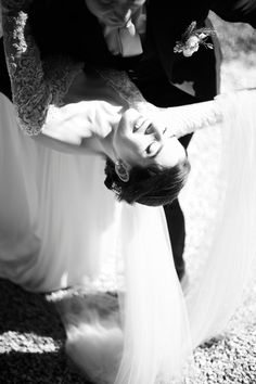 the bride and groom are getting ready to take their wedding pictures together in black and white