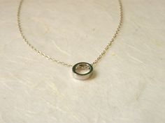 "Elegant and simple. Tiny circle charm with a delicate sterling silver chain. It is a simply beautiful piece perfect for giving to a special someone or as a gift to yourself! ♥ Circle measures 8mm ♥ Length shown on the model in the photo is 17\" Comes beautifully wrapped and ready for gift giving :) For Gold version: https://www.etsy.com/listing/264080858/delicate-circle-necklace-karma-necklace Enter Shop here: lalinne.etsy.com. Thank you so much for looking" Simple Round Pendant Charm Necklace For Anniversary, Minimalist Round Pendant Charm Necklace For Anniversary, Gift Silver Chain Necklace, Circular Silver Chain Necklace Gift, Minimalist Silver Chain Charm Necklace As Gift, Minimalist Silver Chain Charm Necklace For Gift, Sterling Silver Circle Charm Necklace With Delicate Chain, Simple Open Circle Necklace For Gifts, Simple Open Circle Necklace For Gift