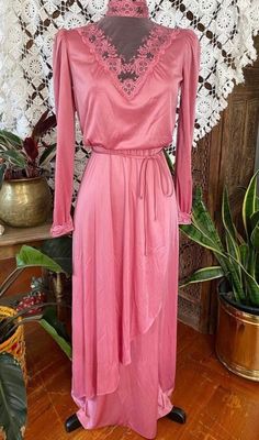 "Vintage 70s does Victorian, pink rose polyester maxi dress with lace neck/chest, fitted waist and matching tie. 100% polyester. Excellent vintage condition! No stains or holes.  Size: Not tagged. BEST FIT S. Always refer to measurements for more accurate sizing. Measurements taken laying flat/Double number where applicable: STS: 16\" PTP: 20\" Waist: 15\" Hip: 22\" SL:18\" inseam, 7\" width L: 56\" ALL SALES ARE FINAL SO PLEASE DOUBLE CHECK THE MEASUREMENTS PRIOR TO BUYING AND DON'T HESITATE TO REACH OUT IF YOU HAVE ANY QUESTIONS!  All items are vintage/preloved and may have small imperfections. This should be expected for secondhand clothing. ALL MAJOR FLAWS WILL BE NOTED IN THE DESCRIPTION AND PHOTOGRAPHED." Pink V-neck Maxi Dress With Lace Trim, Lace Neck, Dress With Lace, Dress Clothes For Women, Second Hand Clothes, Vintage 70s, Pink Rose, Lace Dress, Dress Outfits