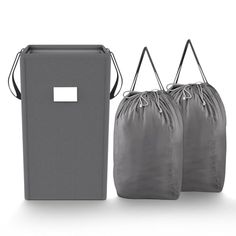 two gray bags with handles are next to each other