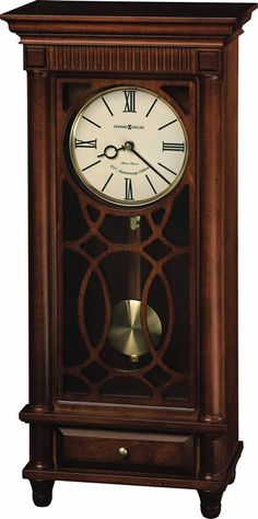 a wooden clock with roman numerals on the front and sides, in an ornate design