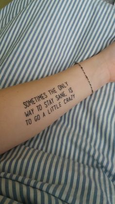 someone's arm with the words sometimes the only way to stay sane is to go a little crazy