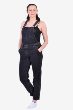 Vintage denim black dungarees from the 1990's. Features adjustable traditional dungaree straps. Three front and two back pockets. Fastens with zips on the hips.  Condition: Excellent vintage condition. Waist: 32in Inside leg: 30in Length: 57in More vintage clothing available on our website www.brickvintage.com Casual Black Straight Leg Overalls, Black Denim Jumpsuit With Straight Leg And Pockets, Black Straight Leg Denim Jumpsuit With Pockets, Black Cotton Overalls Jeans, Black Cotton Overalls, Washed Black Denim Overalls With Pockets, Denim Overalls With Pockets In Washed Black, Black Denim Overall Jumpsuit For Streetwear, Black Denim Dungarees