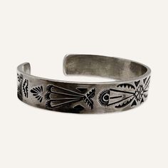 This is part of Chairish’s Costume Jewelry assortment.  Hopi sterling silver cuff bracelet by Lucian Koinva. This Hopi cuff bracelet is stamped with traditional Hopi motifs and contrasted with niello. It is hallmarked with the initials L K.  This cuff is in very good original condition with wear consistent with age and use.  Dimensions: 1.12” opening, 2.75” interior length, 2” interior depth, .5” height Chanel Cuff, Gold Cuffs, Sterling Silver Cuff Bracelet, Animal Skin, Sterling Silver Cuff, Silver Cuff Bracelet, Silver Cuff, Cuff Bracelet, Costume Jewelry