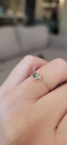 "This adorable and dainty heart ring is the perfect gift for you or someone special. The petite sterling silver heart creates a warm and romantic look, perfect for everyday wear or special occasions. A great way to celebrate a friendship, honor your bridesmaids, or say \"I love you\" to family. Band is a comfortable and wearable 1mm wide. Available in US sizes 5-9. If the size you need is not listed, please let me know." I Love You Ring, Silver Heart Ring, Cardboard Jewelry Boxes, Romantic Look, Heart Gifts, Cute Rings, Keep Jewelry, Metal Pendant, Sterling Silver Heart