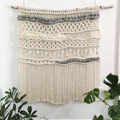 there is a wall hanging made out of macrame